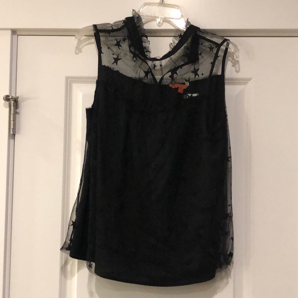 Cute star lace overlay high ruffle neck top.